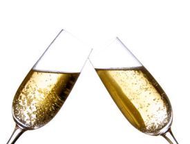 two champagne flutes touching in a toast